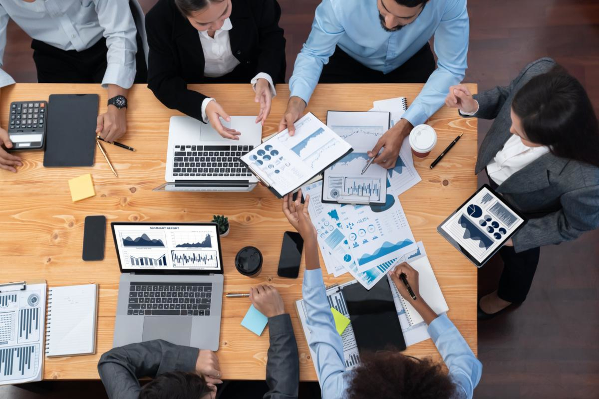 Business people working at a large office desk